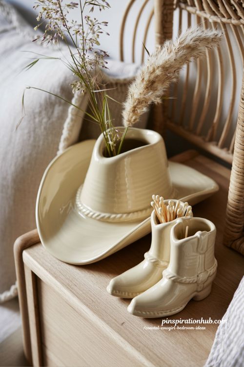 ceramic cowboy hat vase with pampas grass coastal cowgirl decor on dresser with neutral boho western styling