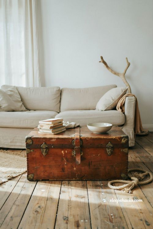 coastal living room ideas with vintage wooden trunk coffee table and nautical rustic decor