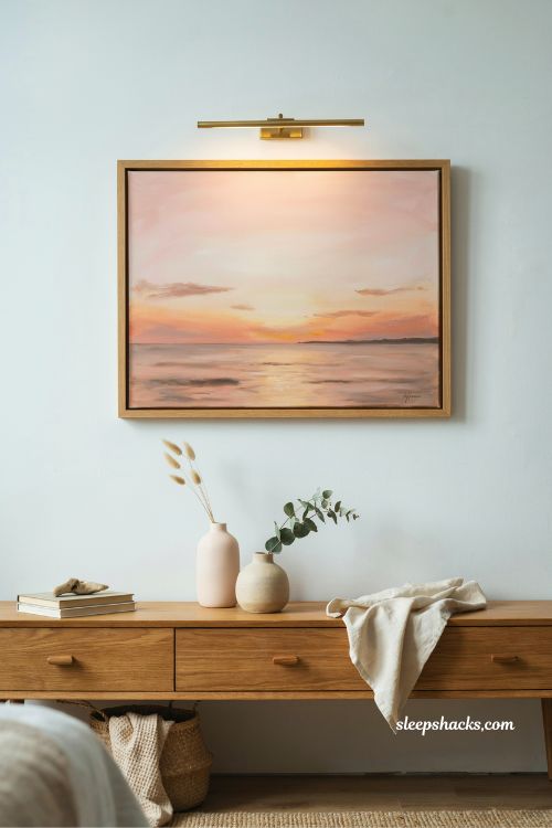 coastal pink sunset artwork above dresser pink and blue bedroom idea with warm ocean inspired tones