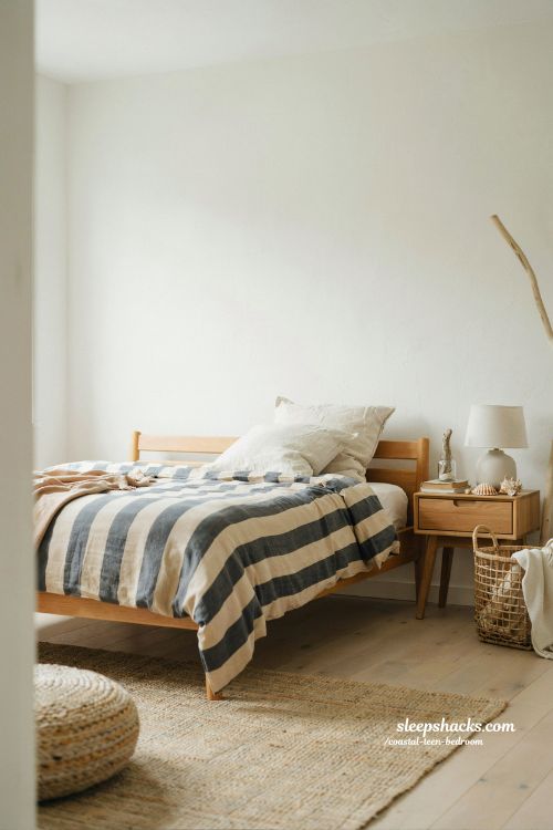 coastal teen bedroom with sandy navy striped bedding and soft modern seaside aesthetic