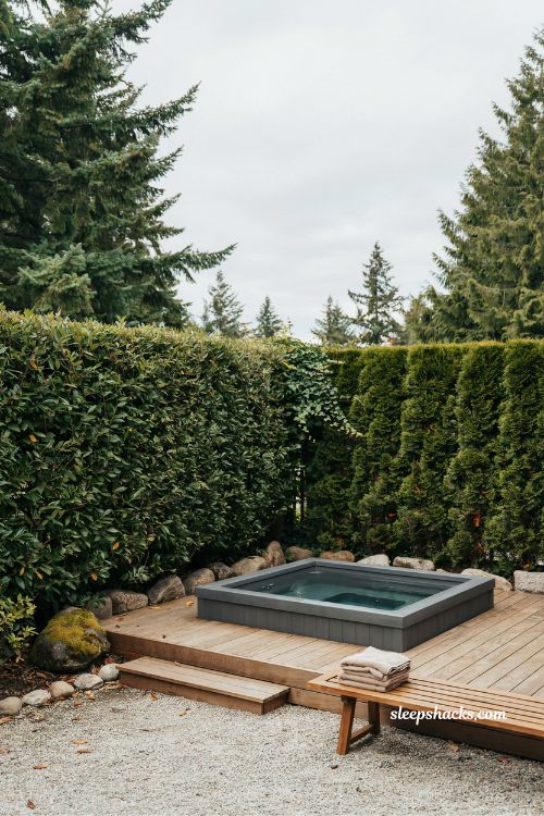 evergreen hedge hot tub garden ideas for a private corner backyard spa