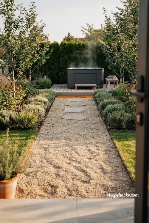 gravel pathway hot tub garden ideas for a calm and intentional backyard spa entrance