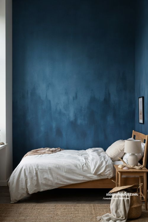 moody coastal teen bedroom with deep ocean blue wall and natural wood calming interior design