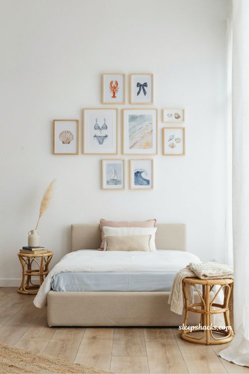 preppy pink and blue coastal gallery wall bedroom idea with playful seaside art and light wood frames