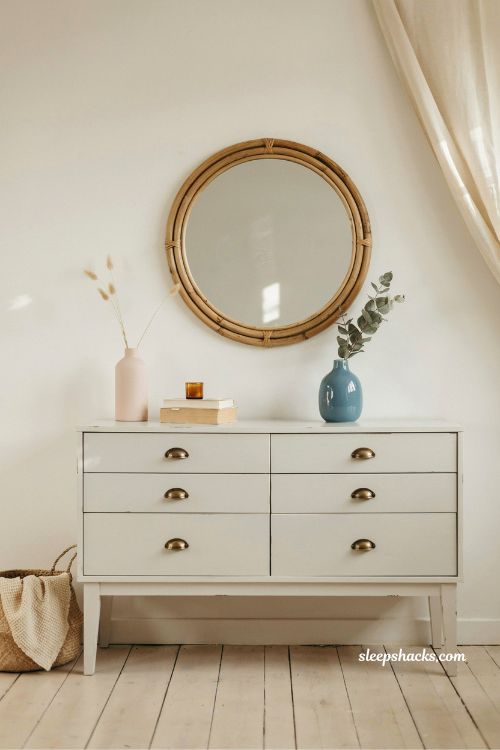 rattan or seashell mirror above dresser coastal bedroom idea with pink and blue airy seaside decor