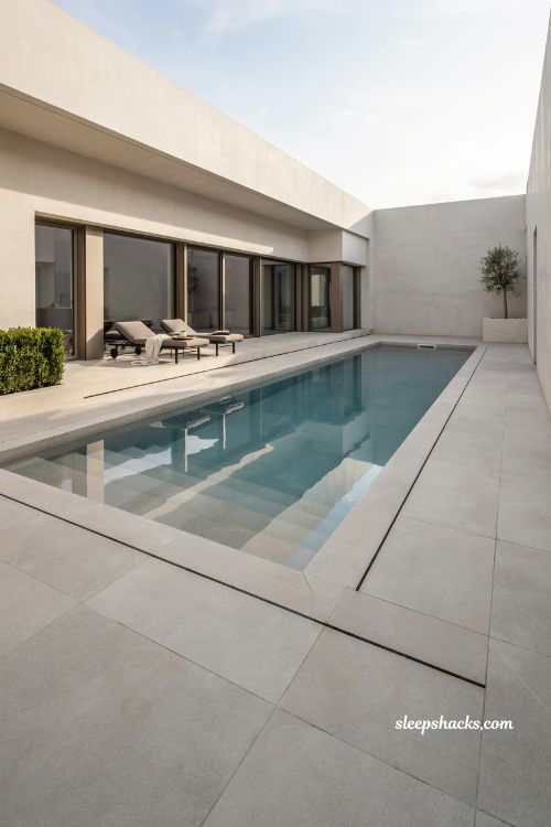sleek rectangular pool design with clean geometric lines and modern minimalist villa style aesthetic