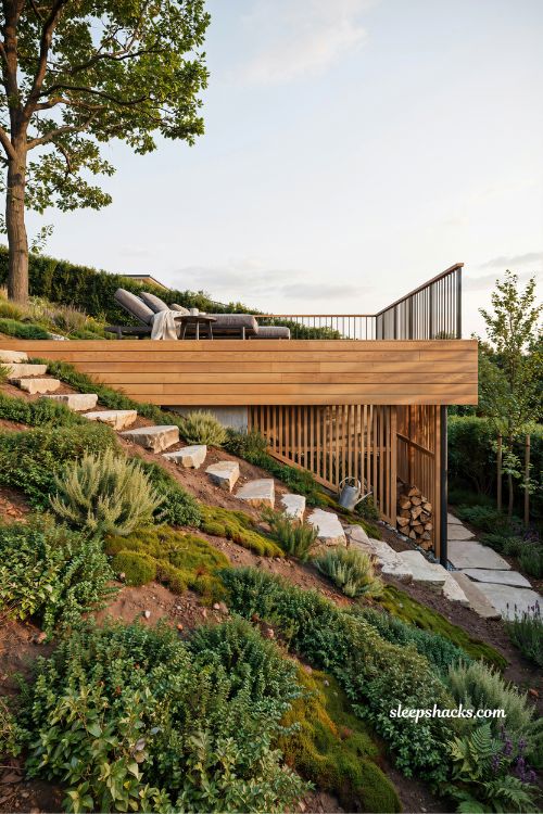 small deck built over steep slope backyard ideas with elevated outdoor seating space