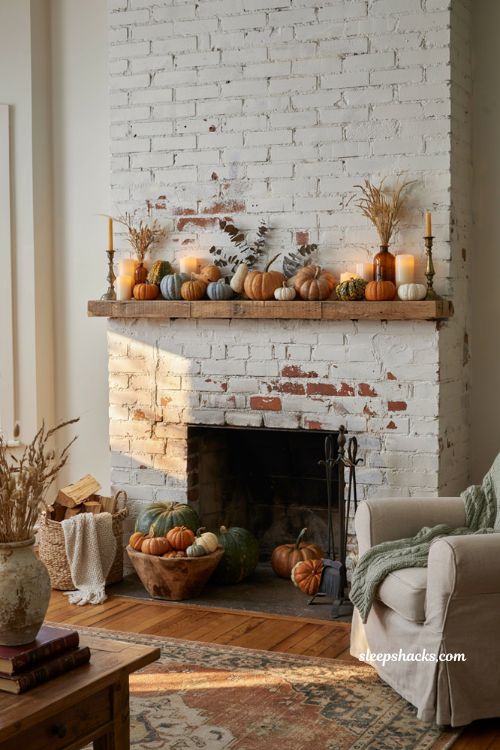 Autumn fireplace decor with heirloom pumpkins and gourds on the mantel and hearth