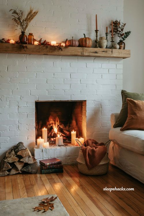 Autumn fireplace decor with layered candlelight and cozy fall mantel styling