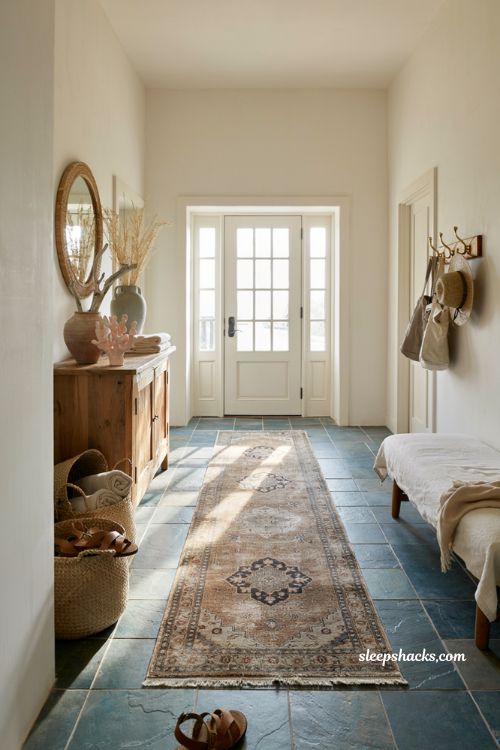 Beach house entryway ideas with blue green slate tile flooring and vintage Persian runner