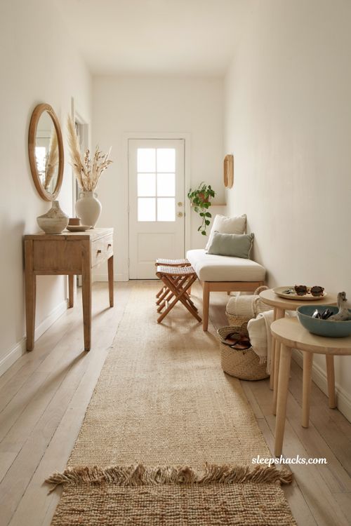 Beach house entryway ideas with linen bench and woven rattan seating