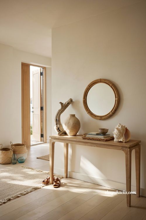 Beach house entryway ideas with sculptural coastal decor and handcrafted ceramic accents