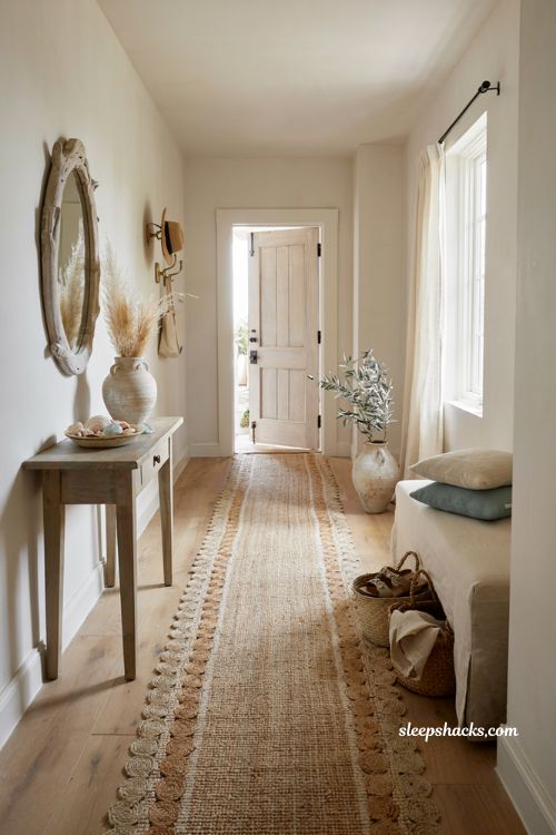 Beach house entryway ideas with woven jute runner and natural fiber coastal decor