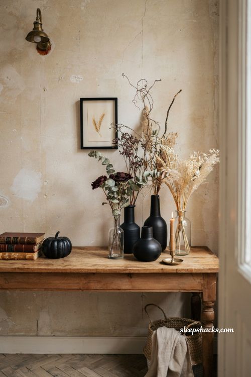 Black vase halloween decor with dried fall stems for an elegant autumn home