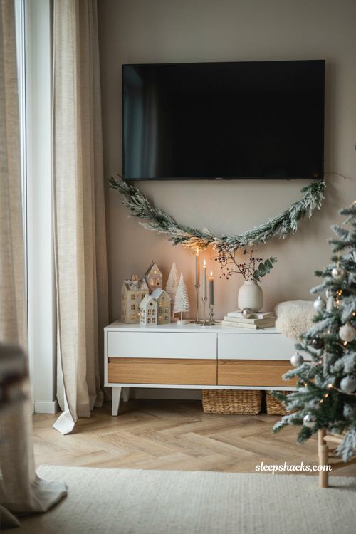 Christmas decor ideas for a living room tv stand with minimalist all white holiday styling
