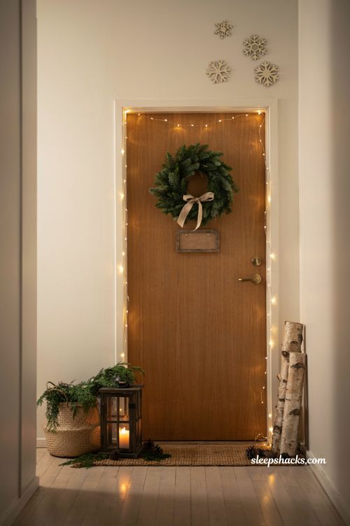 Christmas door ideas for work with simple string lights and cozy minimalist office door decor