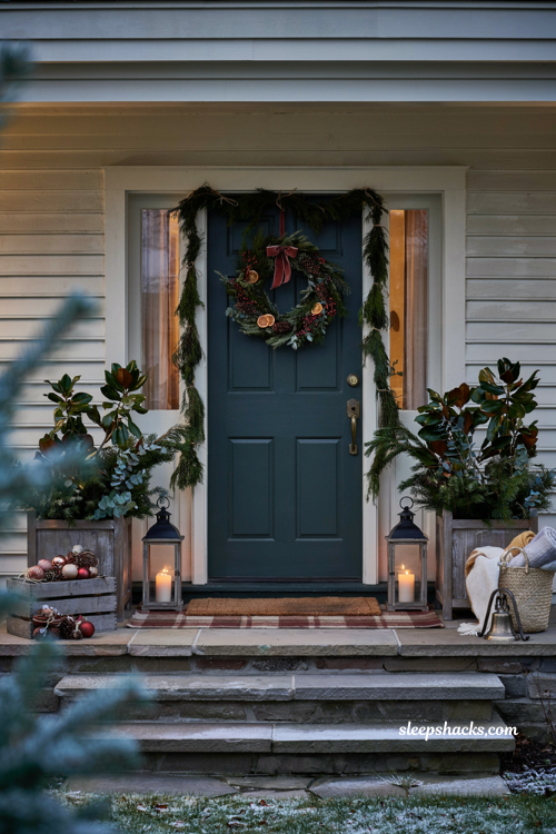 Christmas front door ideas with magnolia door basket and elegant farmhouse holiday greenery