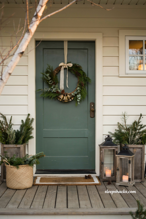 Christmas front door ideas with diy embroidery hoop wreath and fresh holiday greenery