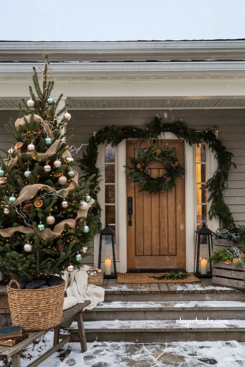 Christmas yard decorations ideas with a mini porch tree in a wicker basket and rustic farmhouse decor