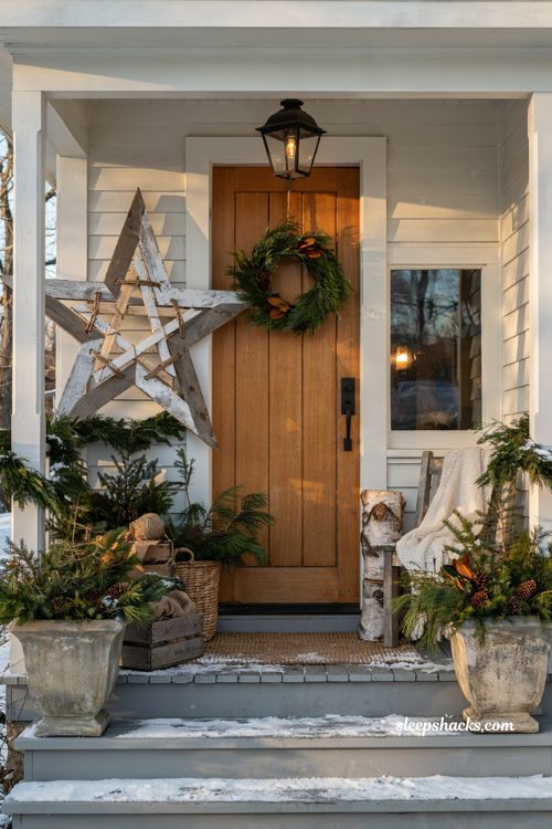 Christmas yard decorations ideas with a rustic scrap wood star and cozy farmhouse porch decor