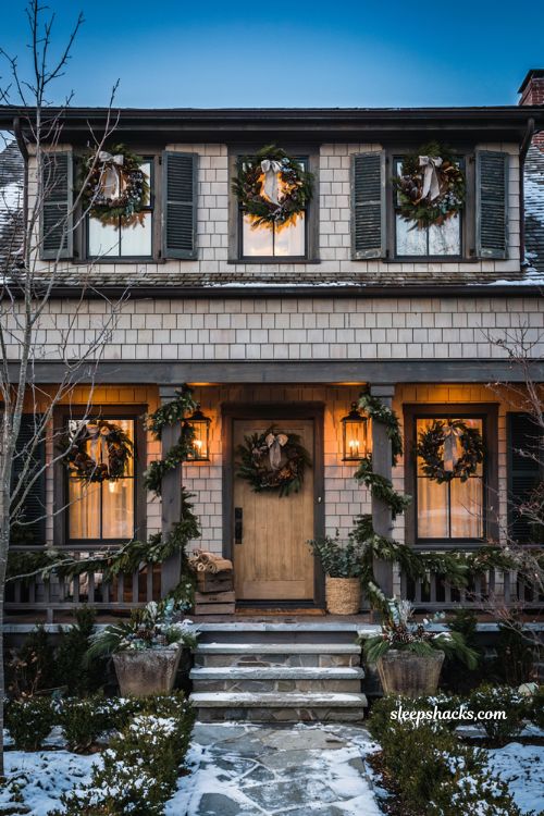 Christmas yard decorations ideas with evergreen window swags and matching wreaths on every window