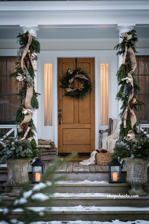 Christmas yard decorations ideas with evergreen wrapped porch columns and rustic farmhouse holiday decor