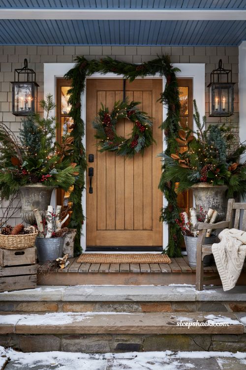 Christmas yard decorations ideas with foraged greenery in rustic urns and farmhouse porch planters