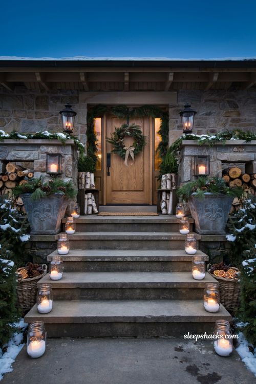 Christmas yard decorations ideas with glowing votive candle jars lining farmhouse front steps