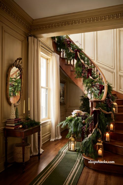 Classic christmas decor with staircase garland and velvet ribbon swags