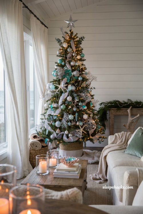 Coastal chic aqua and silver Christmas tree with elegant beach inspired holiday decor