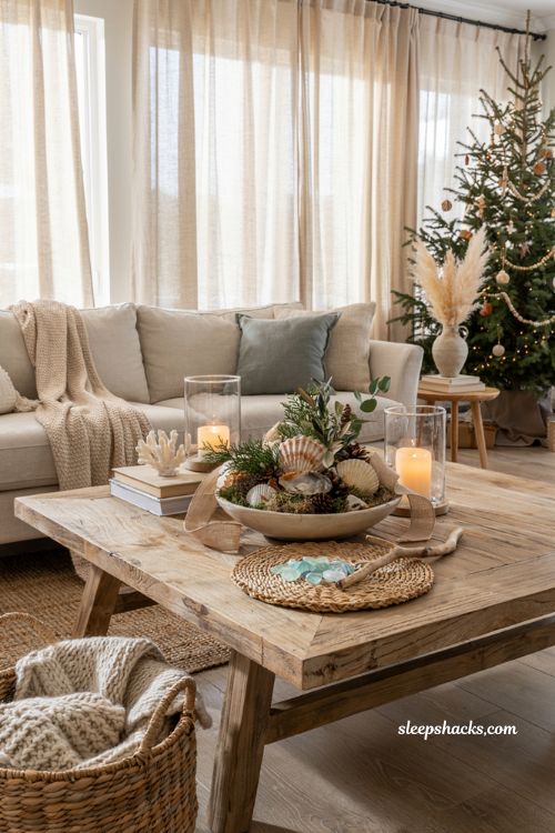 Coastal christmas coffee table centerpiece with seashells sand dollars and natural holiday styling