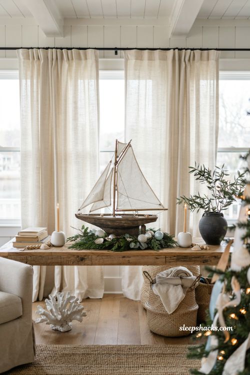 Coastal christmas living room with a model sailboat and elegant nautical holiday decor