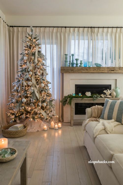 Coastal christmas living room with blue and aqua candlesticks and warm seaside holiday glow