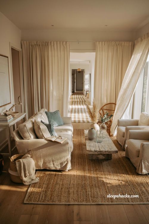 Coastal living room with woven jute rug natural fiber textures and relaxed seaside decor