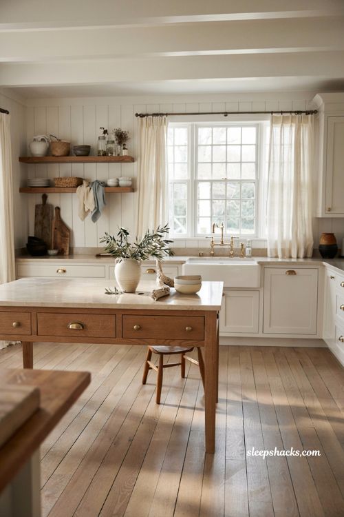 Coastal farmhouse kitchen ideas with mixed natural wood tones and white shaker cabinets