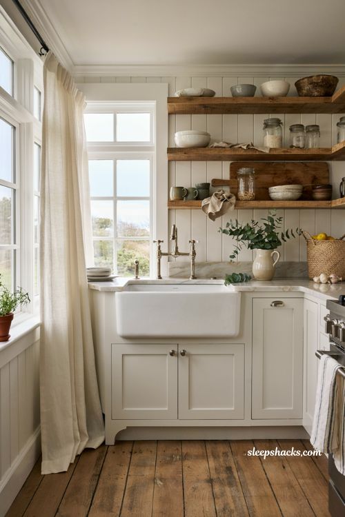 Coastal farmhouse kitchen ideas with white apron front sink and marble countertops