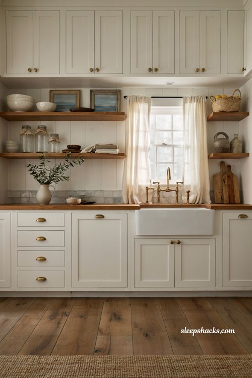 Coastal farmhouse kitchen ideas with white shaker cabinets and butcher block countertops