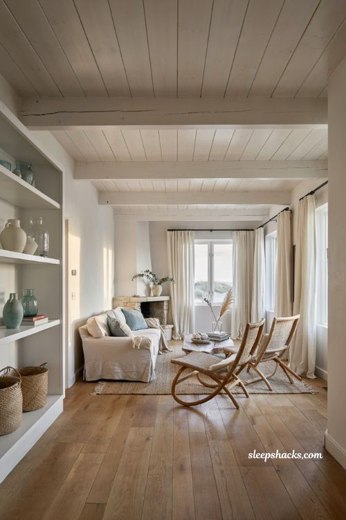 Coastal living room with white wooden beam ceiling and timeless Hamptons style decor