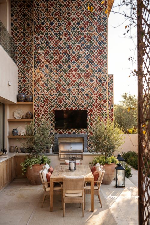 Colorful backyard ideas with patterned tiled accent wall and outdoor kitchen patio