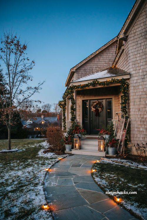 Diy Christmas yard decorations with glowing pathway lights and festive front entrance