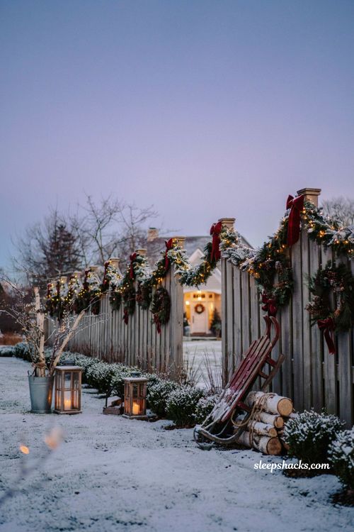 Diy Christmas yard decorations with pre lit garland fence and holiday wreaths