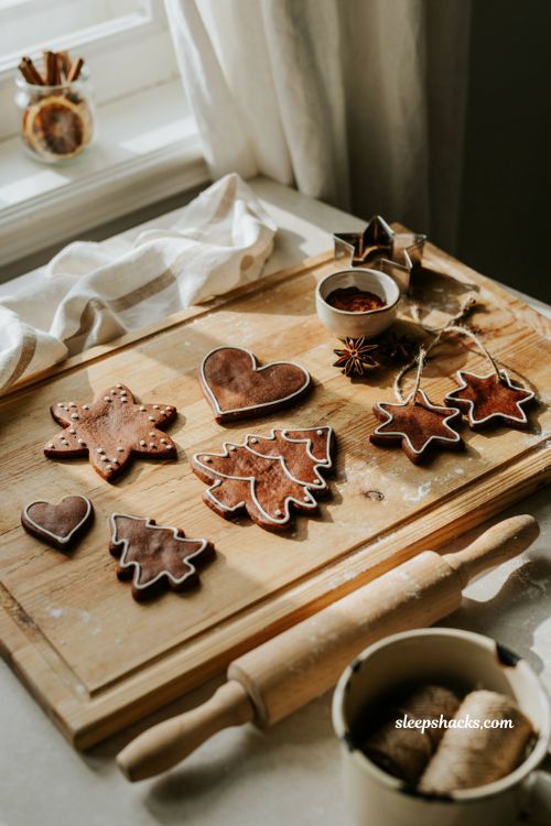 Diy cinnamon salt dough ornaments decorated like gingerbread cookies with twine for christmas