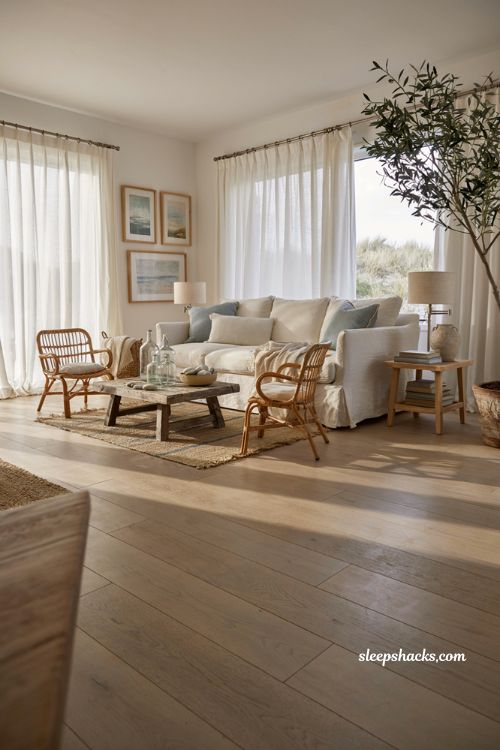 Easy coastal living room ideas with a relaxed white slipcovered sofa