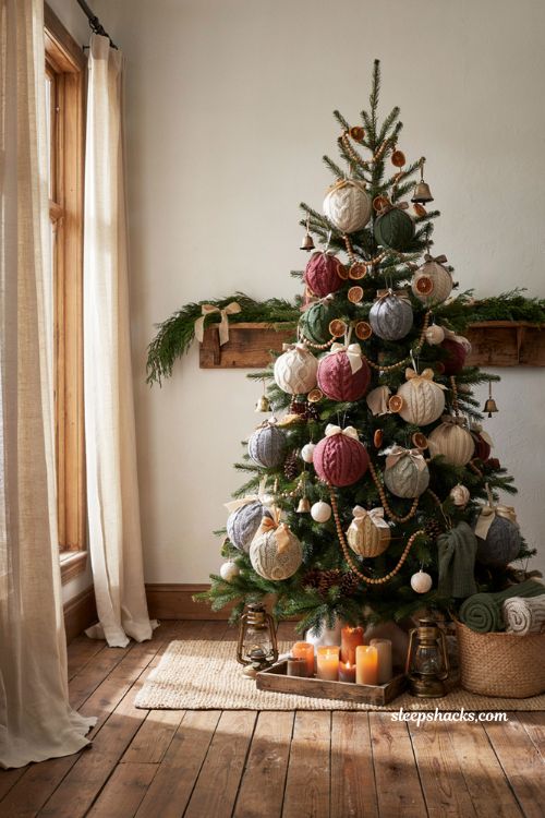 Fabric covered christmas baubles from old sweaters on a cozy farmhouse holiday tree