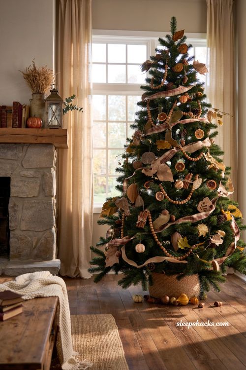 Fall christmas tree ideas with brown wood bead garland in a cozy farmhouse living room