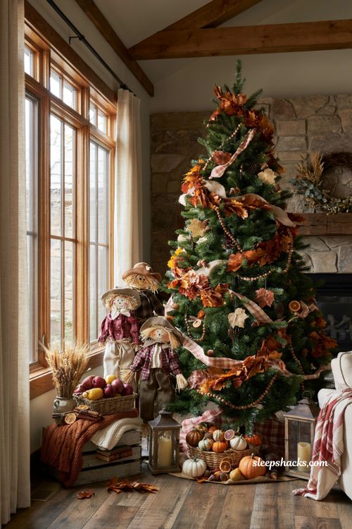 Fall christmas tree ideas with scarecrow figures and harvest decor at the tree base