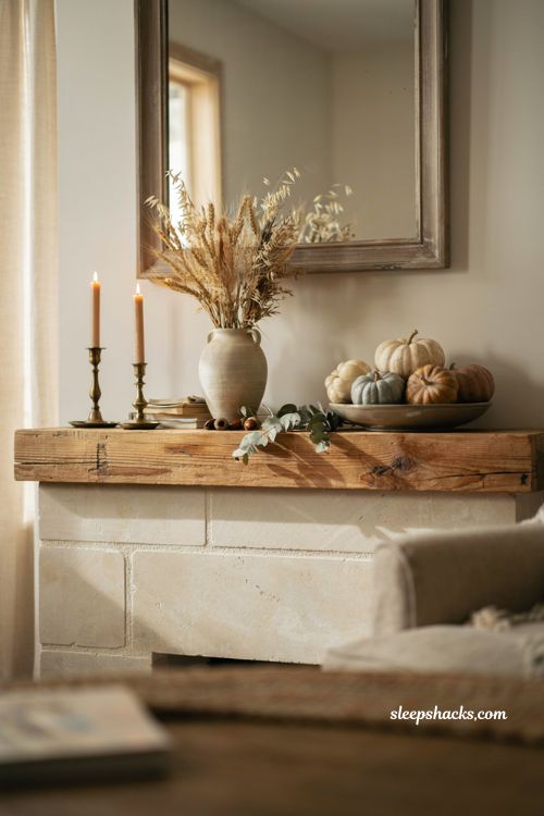 Fall mantle decor with dried wheat and ornamental grass in a cozy farmhouse fireplace arrangement