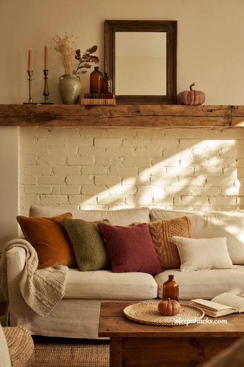 Fall mantle decor with matching autumn throw pillows for a cozy farmhouse living room