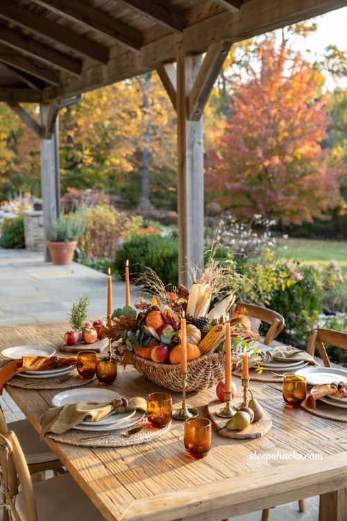 Fall outdoor decor ideas with a harvest cornucopia centerpiece on the patio table
