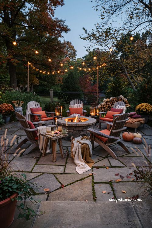 Fall patio decor with cozy fire pit seating and warm autumn blankets